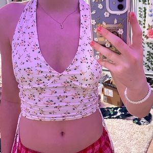 white with yellow flowers halter top, strings hang off the side, women’s xs